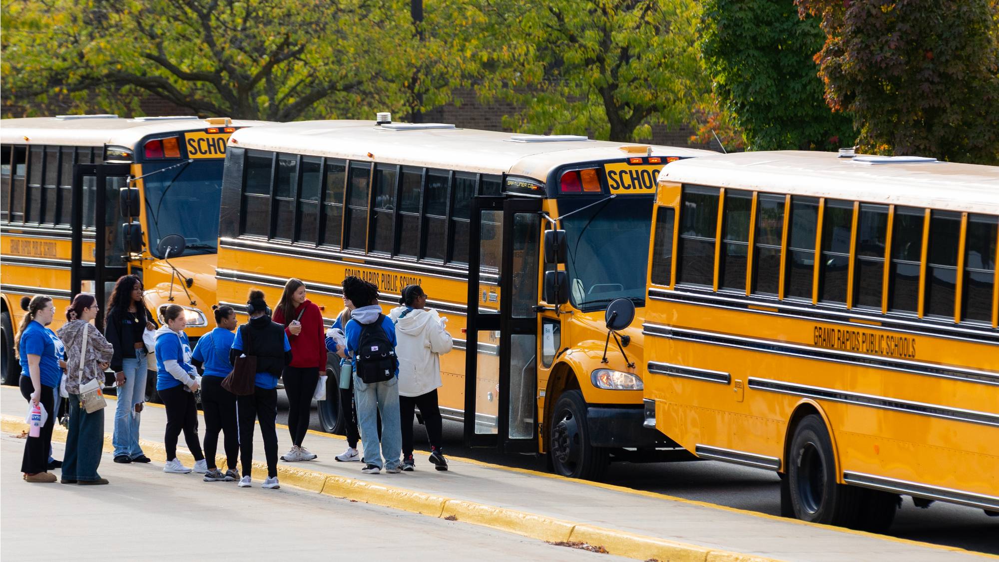 people loading buses